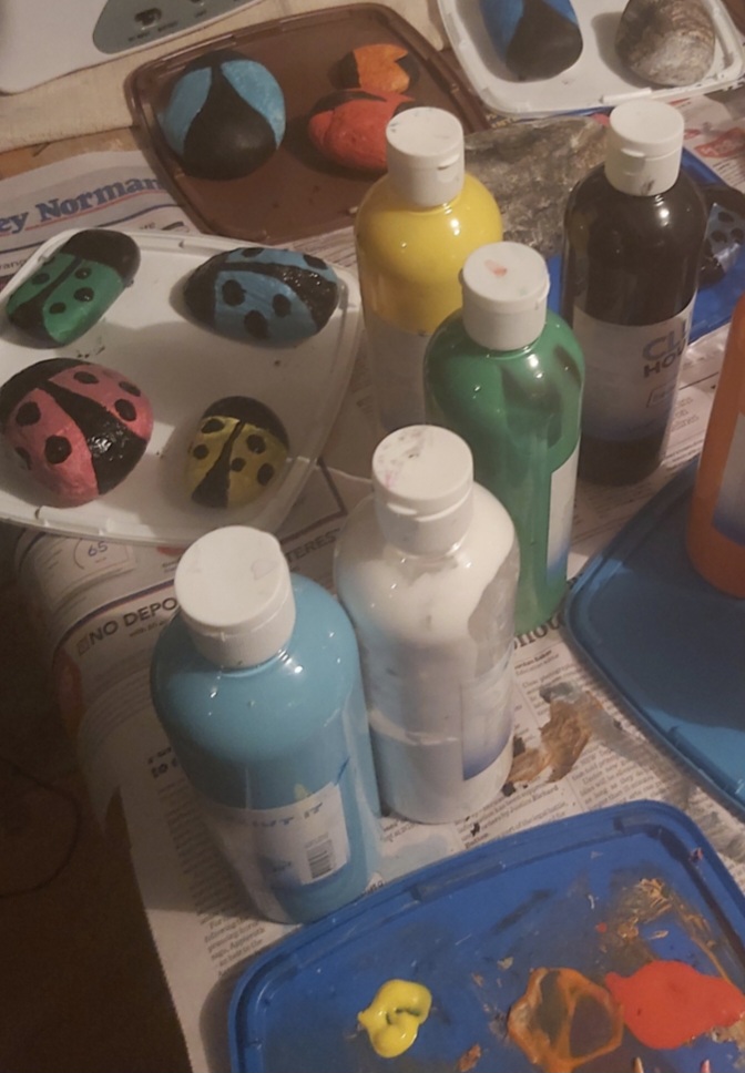 Rainbow Parrot Design Studio painting rocks